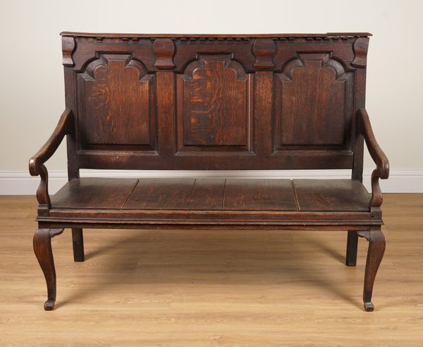 A 18TH CENTURY OAK TRIPLE PANEL BACK OPEN ARM SETTLE