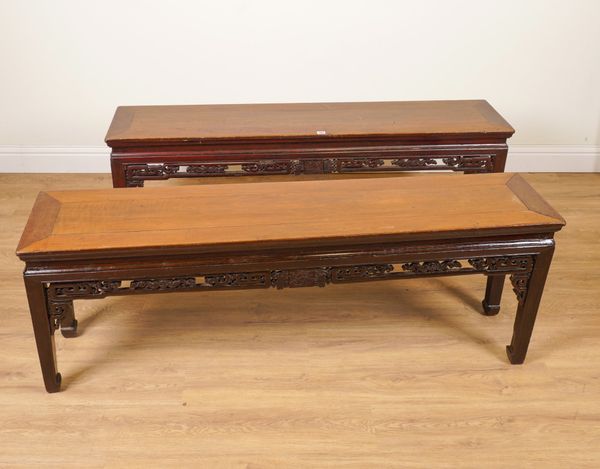 A PAIR OF EARLY 20TH CENTURY CHINESE RECTANGULAR HARDWOOD LOW TABLES WITH PIERCED AND CARVED FRIEZE (2)