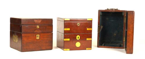TWO BRASS-MOUNTED MAHOGANY CHRONOMETER BOXES AND A MAHOGANY CARRIAGE CLOCK CASE (3)