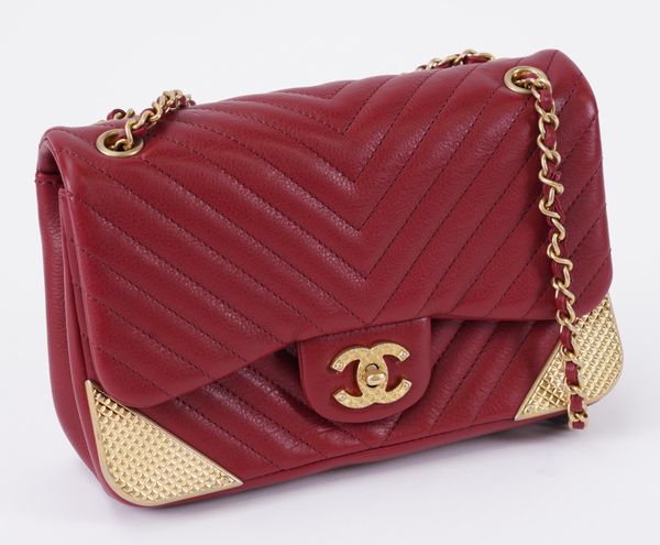 CHANEL: A RED CHEVRON MINI FLAP BAG