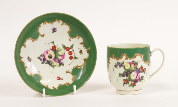 A WORCESTER GREEN-GROUND COFFEE CUP AND A SAUCER (2)