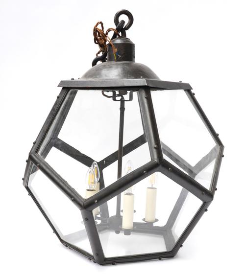 A LARGE BLACK LACQUERED METAL FACETED HANGING LIGHT