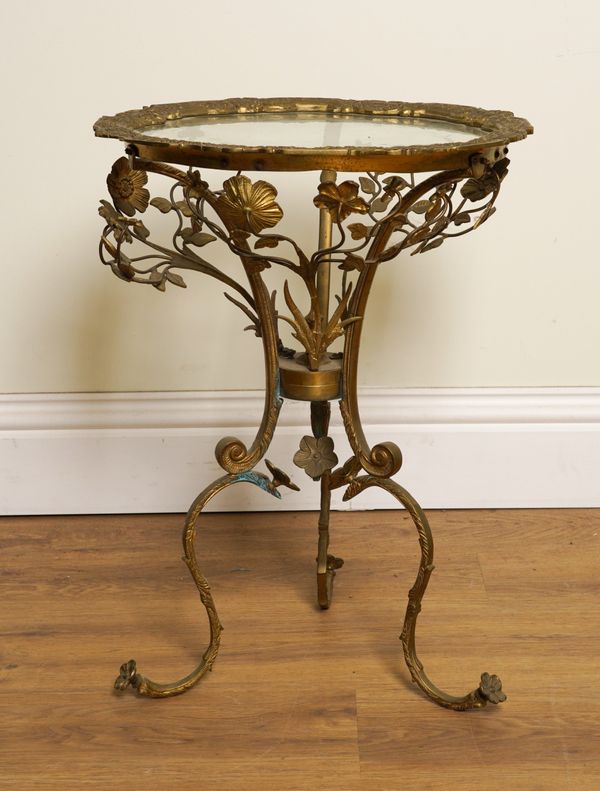 A LOUIS XVI STYLE BRASS AND GLASS MOUNTED OCCASIONAL TABLE