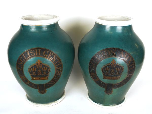 A PAIR OF GREEN GLAZED BALUSTER VASES WITH MILITARY BADGE CARTOUCHE (2)