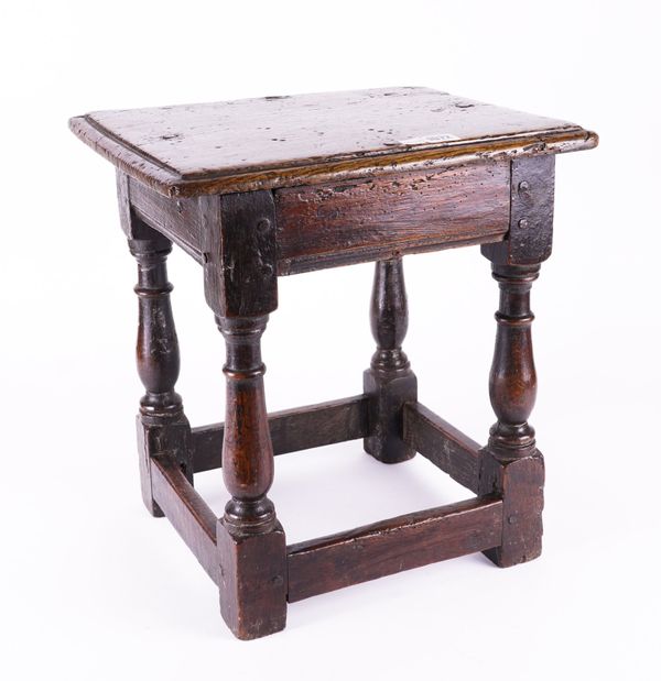 A 17TH CENTURY OAK JOINT STOOL ON BALUSTER TURNED SUPPORTS