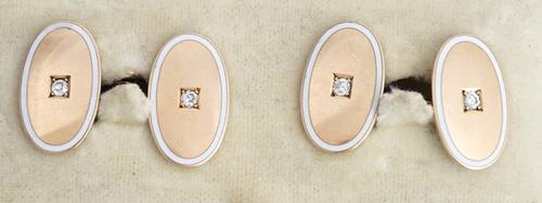 A pair of gold enamelled and diamond set cufflinks.