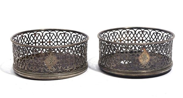 A PAIR OF IRISH SILVER MOUNTED CIRCULAR BOTTLE COASTERS (2)