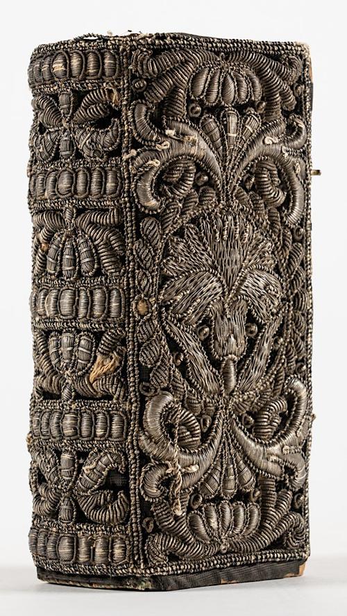 BINDING - Embroidered silver wire or bullion thread binding with densely-worked floral and foliate pattern over the whole surface, gilt edges, [?mid-17th-century], tall 12mo, containing notebook with blank leaves.