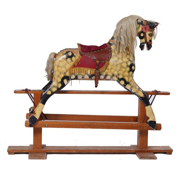 A GESSO PAINTED BEECH ROCKING HORSE