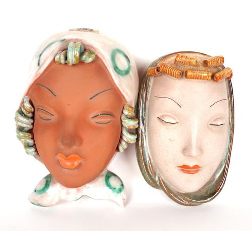 TWO ART DECO GOLDSCHEIDER WALL MASKS INCLUDING ONE BY RUDOLF KNORLEIN (2)