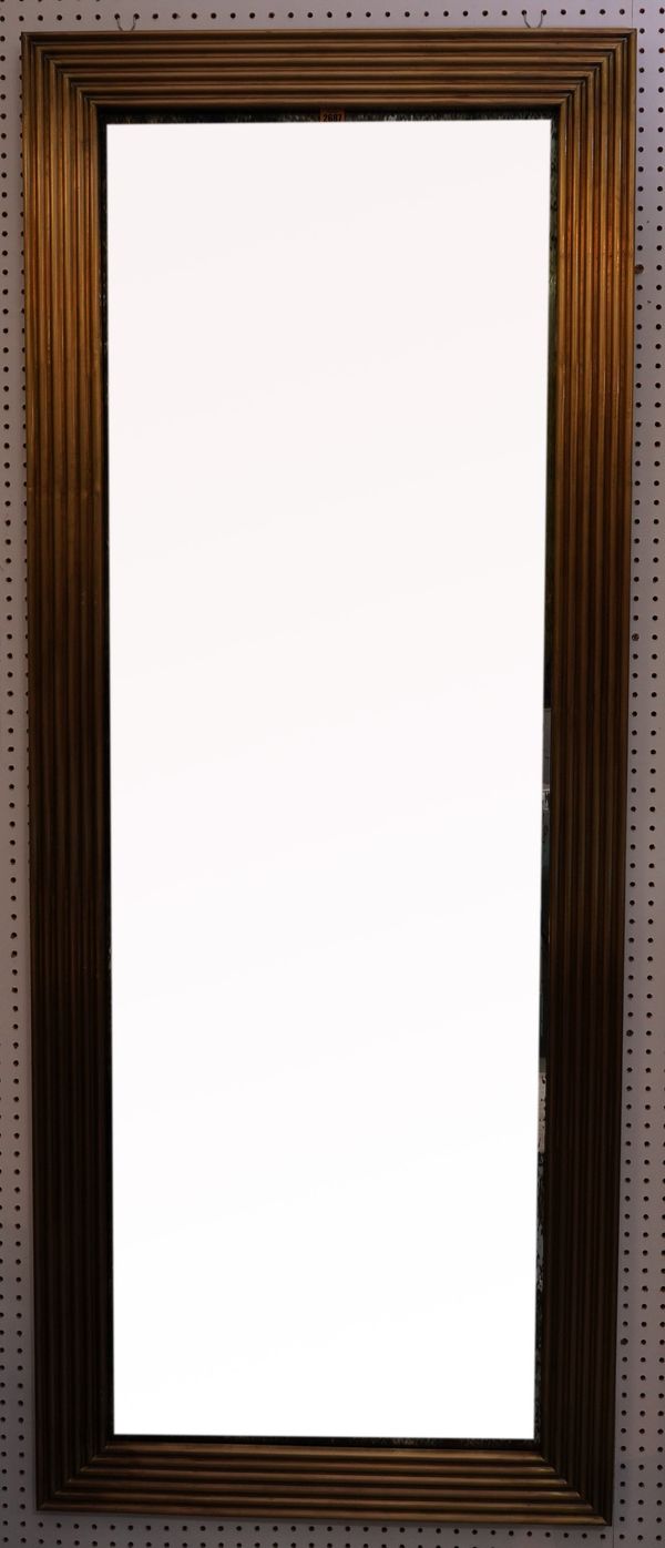 A MODERN BRASS RECTANGULAR WALL MIRROR