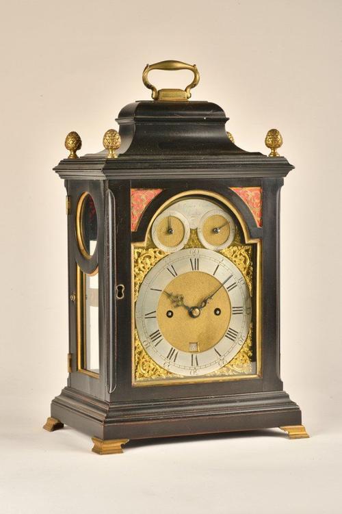 A GEORGE III BRASS-MOUNTED EBONISED STRIKING VERGE TABLE CLOCK