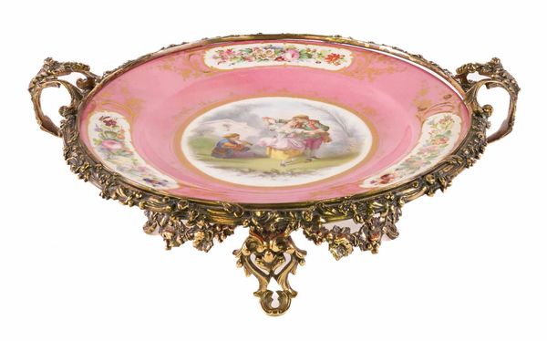 A LARGE SEVRES STYLE PINK-GROUND DISH WITH GILT-METAL MOUNTS