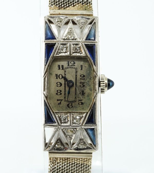 A LADY'S PLATINUM CASED, DIAMOND AND SYNTHETIC SAPPHIRE RECTANGULAR CASED LADY'S DRESS WRISTWATCH