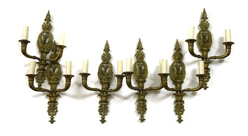 A SET OF SIX EMPIRE STYLE GILT-METAL TWIN LIGHT WALL-APPLIQUÉS (6)