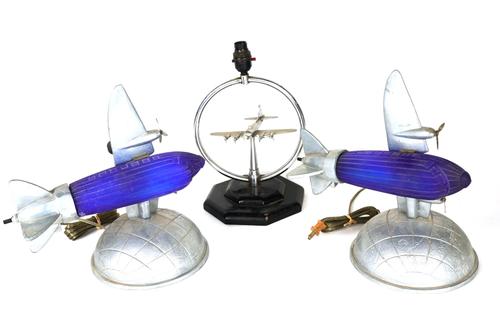 SARSAPARILLA DECO DESIGNS: TWO BLUE MOULDED GLASS AIRPLANE LAMPS AND TWO OTHERS (4)