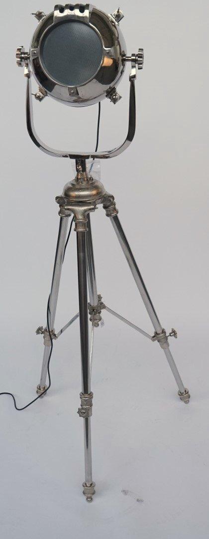 A NICKEL FINISHED FLOOR STANDING CINEMA SPOT-LIGHT
