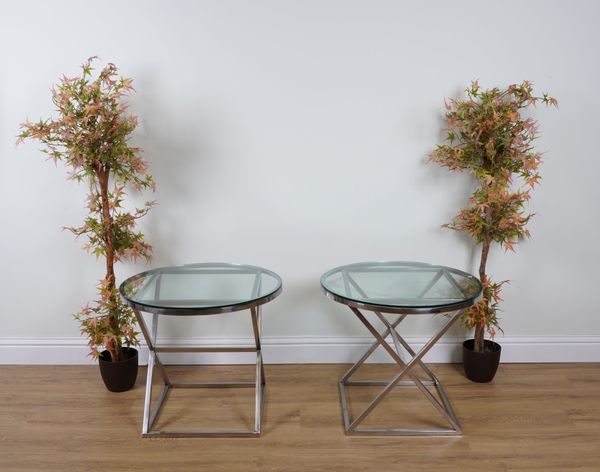 A PAIR OF CIRCULAR CHROME AND GLASS TOPPED OCCASIONAL TABLES (2)