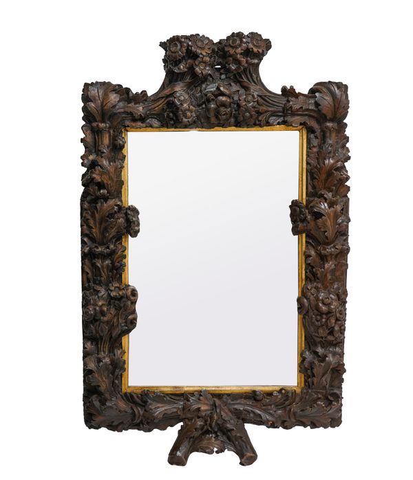 A 19TH CENTURY BLACK FOREST MIRROR