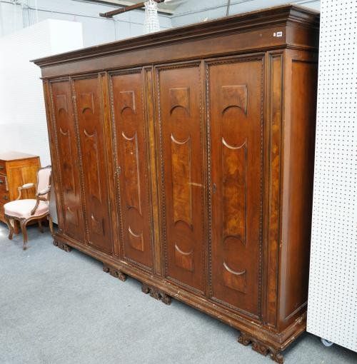 A WALNUT FIVE DOOR WARDROBE OF 17TH CENTURY ITALIAN STYLE