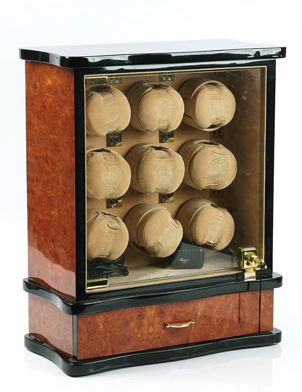A RAPPORT NINE WATCH WINDER WITH A LOWER DRAWER