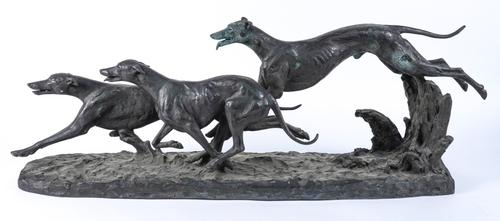 MAXIMILIAN FIOT (FRENCH 1886-1953): A PATINATED BRONZE GROUP OF THREE GREYHOUNDS