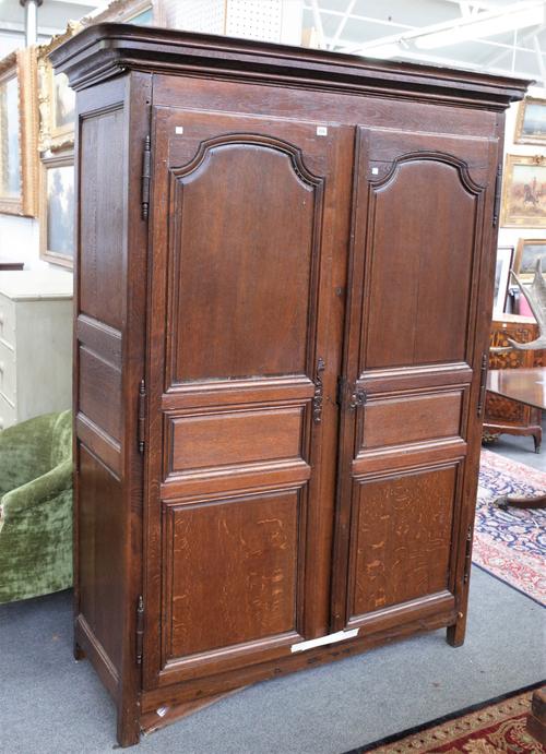 A LATE 18TH/EARLY 19TH CENTURY FRENCH OAK TWO DOOR ARMOIRE