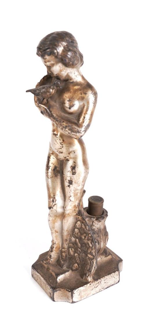 AN ART DECO SILVERED METAL FIGURAL TABLE LIGHTER