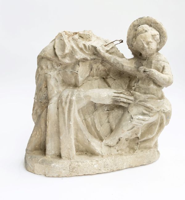 A LARGE PLASTER ORNAMENT OF A MOTHER AND CHILD