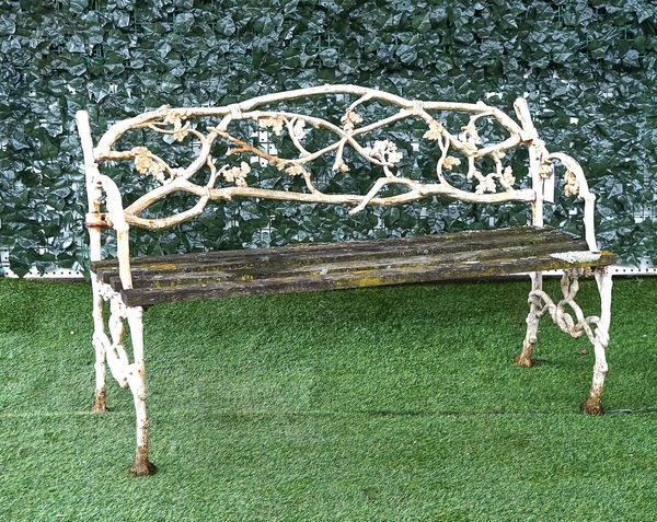 A VICTORIAN WHITE PAINTED CAST IRON GARDEN BENCH