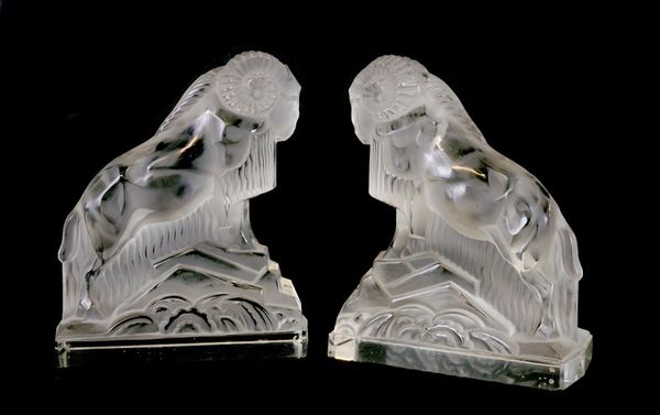 A PAIR OF ART DECO FROSTED GLASS RAM BOOKENDS (2)