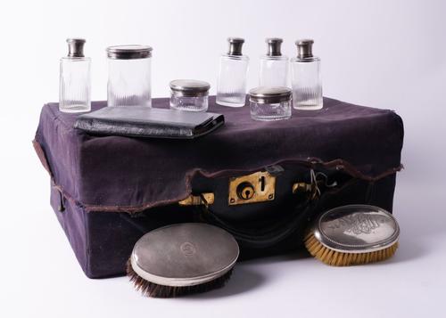 A FRENCH SILVER MOUNTED TRAVELLING TOILET SET