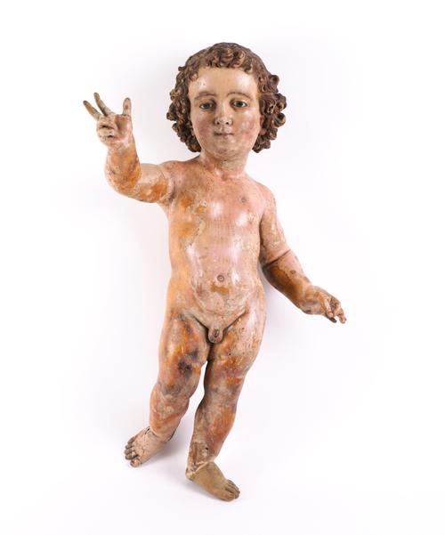 A SPANISH POLYCHROME CARVED INFANT CHRIST