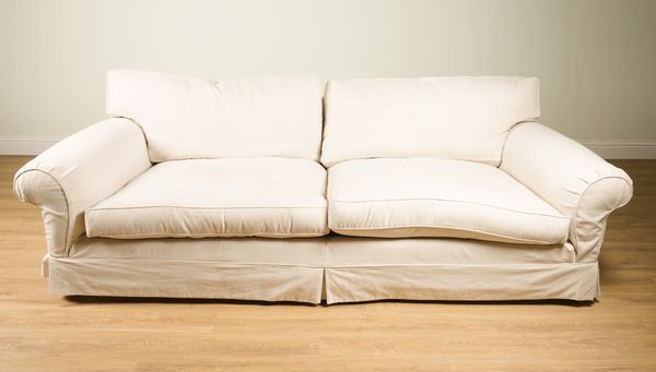 DURESTA; A LARGE DEEP SEAT SOFA WITH LOOSE CREAM COVERS