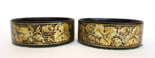 A PAIR OF REGENCY PAPIER-MÂCHÉ BOTTLE COASTERS (2)