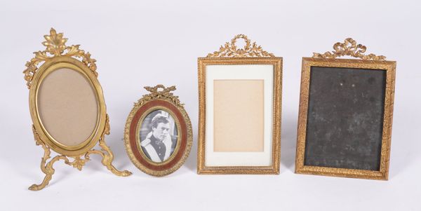 A GROUP OF FOUR FRENCH GILT-METAL EASEL PICTURE FRAMES (4)