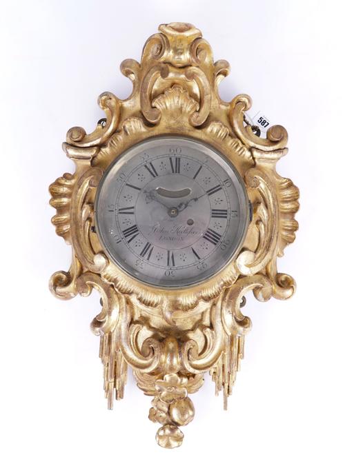 JOHN HALIFAX, LONDON: A GEORGE II GILTWOOD WALL CLOCK WITH QUARTZ MOVEMENT