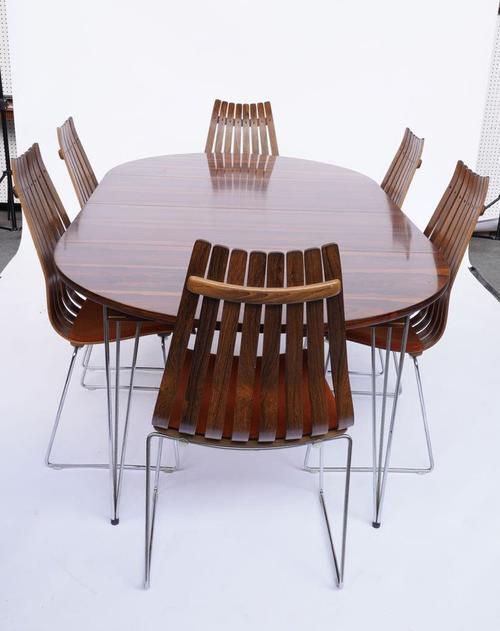 HANS BRATTRUD FOR HOVE MOBLER; A MID 20TH CENTURY ROSEWOOD DINING ROOM SUITE (7)