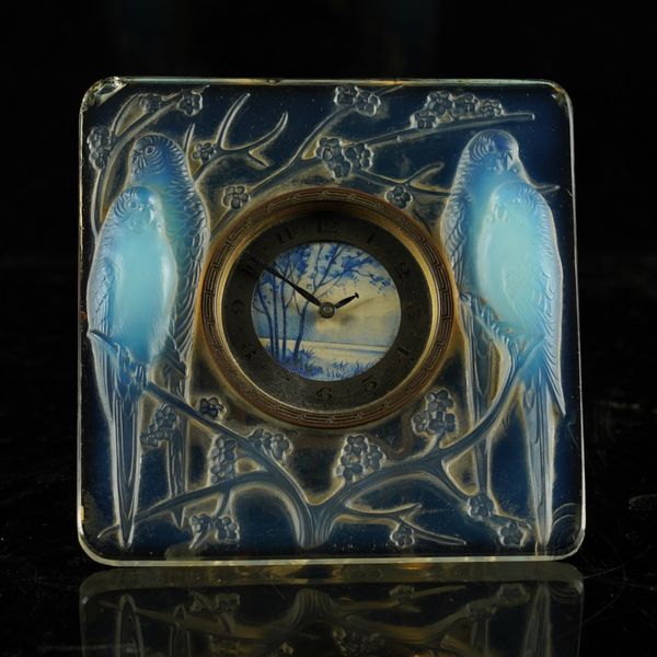 A LALIQUE `INSEPERABLES' CLEAR AND OPALESCENT GLASS CLOCK