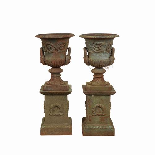 A PAIR PAINTED CAST IRON GARDEN URNS (4)