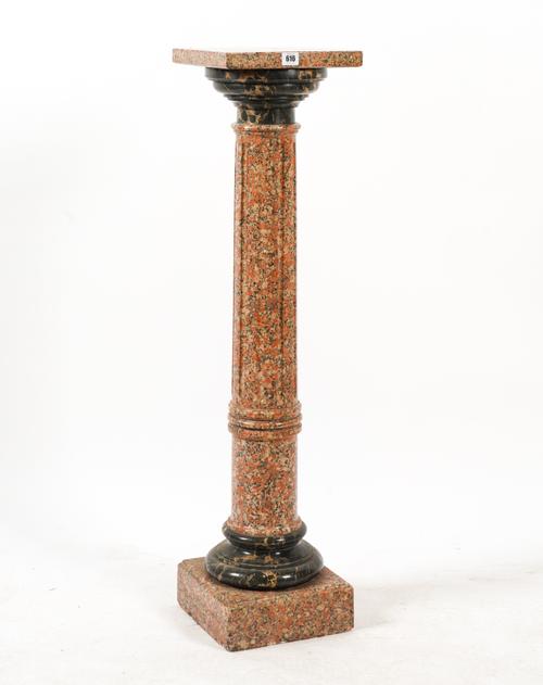 A RED FAUX MARBLE OR SCAGLIOLA PEDESTAL COLUMN