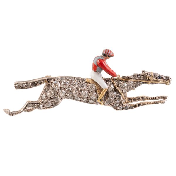 A RACEHORSE AND JOCKEY BROOCH