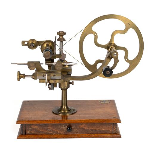 A GERMAN STEEL AND BRASS WHEEL-CUTTING TOOL