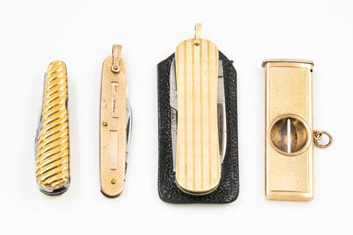 THREE POCKET KNIVES AND A 9CT GOLD MOUNTED CIGAR CUTTER (4)