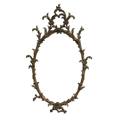 A GEORGE III STYLE GILT FRAMED OVAL MIRROR