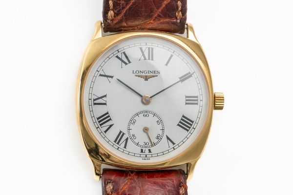 A GOLD LONGINES WATCH