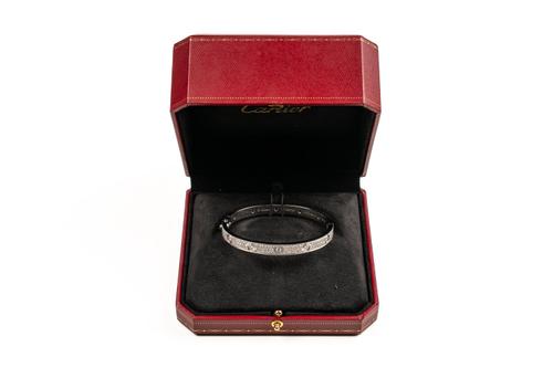 A CARTIER TWELVE DIAMOND PAVÉ SET LOVE BANGLE