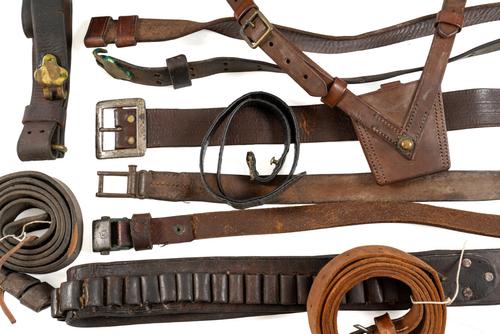 A LARGE GROUP OF MILITARY AND CIVILIAN LEATHER BELTS AND SLINGS