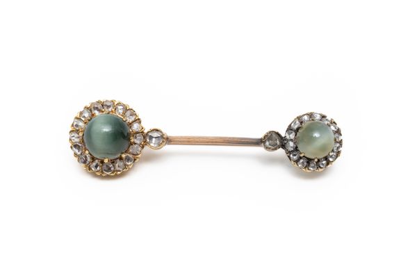 A CAT'S EYE CHRYSOBERYL AND DIAMOND BROOCH (2)