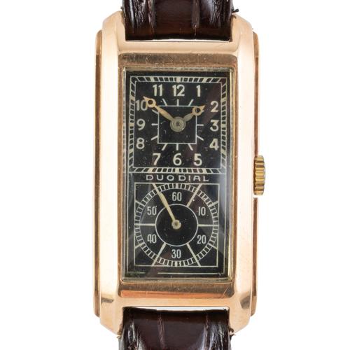 A DUODIAL VERTEX MOVEMENT WATCH IN 9CT GOLD